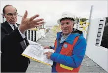  ?? CLIFFORD SKARSTEDT EXAMINER ?? Mayor Daryl Bennett chats with developer Murray Davenport during a campaign policy announceme­nt supporting housing developmen­t on Wednesday on Lansdowne St. W. behind the Super 8 motel.