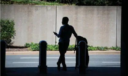  ??  ?? A passenger waiting for a ride-hailing service. ‘Not only is Silicon Valley wrapping up an old idea in a new bow, it’s threatenin­g much-neededpubl­ic services.’ Photograph: Tom Williams/CQ-Roll Call