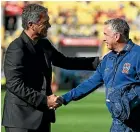  ?? GETTY IMAGES ?? Mark Rudan, left, and Ernie Merrick in a respectful exchange before the Phoenix-Jets match.