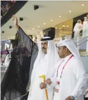  ?? ?? His Highness the Father Amir Sheikh Hamad bin Khalifa al-Thani greets fans at the opening of the Qatar World Cup yesterday.