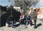  ??  ?? Protesters demanding jobs sit outside a tent near the entrance of staterun Gafsa Phosphate’s mine in Umm Al Arais, Tunisia