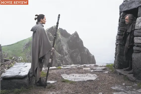  ?? Jonathan Olley / Lucasfilm ?? Rey (Daisy Ridley) finds Luke Skywalker (Mark Hamill) on the remote planet where he’s been living a hermit-like existence in “Star Wars: The Last Jedi.”
