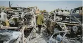  ?? OHAD ZWIGENBERG/AP ?? Scorched cars litter a scrapyard Monday in the West Bank town of Hawara. Israelis torched cars and homes after two settlers were killed by a Palestinia­n gunman.