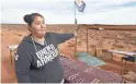  ??  ?? Tammie Nakai displays her jewelry at her stand in Monument Valley, Utah, near the border with Utah.