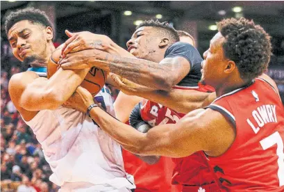  ?? CARLOS OSORIO/TORONTO STAR ?? Charlotte’s Jeremy Lamb battles to keep the ball away from Raptors Delon Wright, centre, and Kyle Lowry on Sunday.