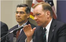  ?? Rich Pedroncell­i / Associated Press ?? McGregor Scott of the U.S. attorney’s office (right) and Attorney General Xavier Becerra talk about the pot-grow problem.