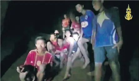  ?? [THAI NAVY SEAL VIA AP] ?? In this screen grab taken from video, the missing boys and their soccer coach are shown Monday in a cave in Chiang Rai in Thailand.