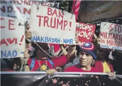  ??  ?? 0 Hundreds protested in Manila ahead of Trump’s arrival