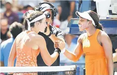  ??  ?? Anastasija Sevastova of Latvia (left) is congratula­ted by Sloane Stephens of the US. — USA TODAY Sports photo