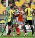  ??  ?? Wellington Phoenix goalkeeper Keegan Smith, left, wasn’t shy about making his presence felt on Saturday.