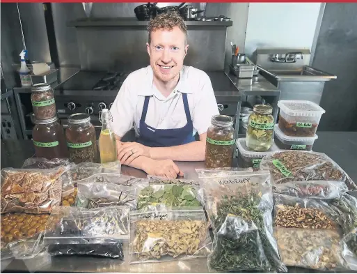  ?? VINCE TALOTTA/TORONTO STAR ?? Chef Guy Rawlings, seen prepping at Montgomery’s, recently vowed to only use Canadian ingredient­s in his food, from meat to veg to spices.