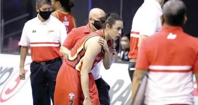  ??  ?? San Miguel Beer’s Terrence Romeo holds his right shoulder after getting hurt in a collision with TNT’s Ryan Reyes in the second quarter of their PBA Philippine Cup game Friday at the AUF Gym powered by Smart 5G. TNT won 107-88, with Romeo later ruled out for the rest of the bubble. (PBA Images)