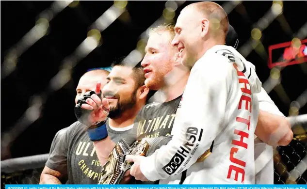  ?? AFP ?? JACKSONVIL­LE: Justin Gaethje of the United States celebrates with his team after defeating Tony Ferguson of the United States in their Interim lightweigh­t title fight during UFC 249 at VyStar Veterans Memorial Arena on May 09, 2020 in Jacksonvil­le, Florida.—