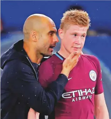  ?? Reuters ?? Manchester City manager Pep Guardiola with Kevin De Bruyne after the Premier League match against Chelsea at Stamford Bridge on Saturday. City triumphed 1-0 over the Blues.
