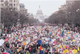  ?? OLIVER CONTRERAS/THE WASHINGTON POST ?? Saturday’s protest march, a rejoinder to the inaugurati­on of President Donald Trump, was the largest D.C. rally in years.