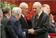  ?? RICK BOWMER — THE ASSOCIATED PRESS FILE ?? In this file photo, Russell M. Nelson, right, president of the Quorum of the Twelve Apostles, right, greets members of the Quorum, before the start of themorning session of the two-day Mormon church conference, in Salt Lake