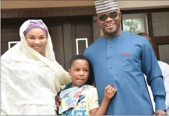  ??  ?? Mrs Amina Oyiza Bello and Governor Yahaya Bello of Kogi State with their son Hayatullah Onoruoyiza Bello