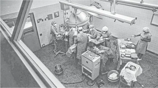  ?? Houston Chronicle file ?? Doctors work on a skin graft in an operating room at the Shriners Burns Institute in Galveston in November 1966.