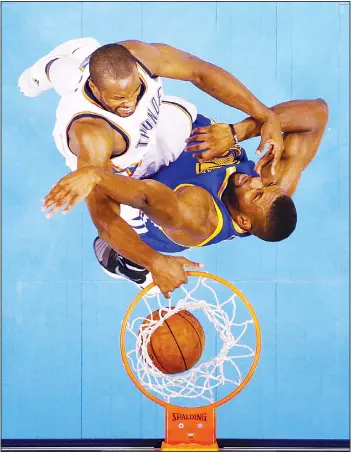  ?? (AFP) ?? Serge Ibaka #9 of the Oklahoma City Thunder dunks against Festus Ezeli #31 of the Golden State Warriors in the first half in game three of the Western Conference Finals during the 2016 NBA Playoffs at Chesapeake Energy Arena on May
22 in Oklahoma...