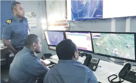  ?? Photo: Rosi Doviverata ?? Fijian Navy personnel manning the Fiji Maritime Surveillan­ce Rescue Co-ordination Centre.