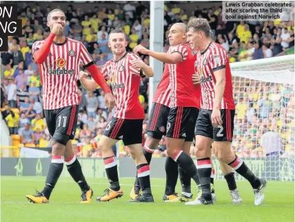  ??  ?? Lewis Grabban celebrates after scoring the third goal against Norwich
