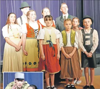  ??  ?? The Von Trapp children, similar to their real life counterpar­ts, demonstrat­e impressive singing ability. 01_B50SOM11