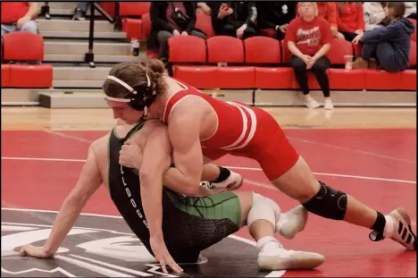  ?? ?? Photo credit: Tom Hendrixson
Corbin Mitchell forces his Celina opponent to the mat during Thursday night Western Buckeye League clash at the Wapak gym. Mitchell got his 34th win and 30th pin of the season to help the Redskins defeat the Bulldogs.