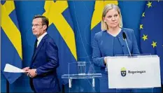  ?? Henrik Montgomery / TT News Agency ?? Sweden’s Prime Minister Magdalena Andersson, right, and the Moderate Party’s leader Ulf Kristersso­n discuss Sweden’s applicatio­n for NATO membership as a deterrent against Russian aggression, on Monday in Stockholm.