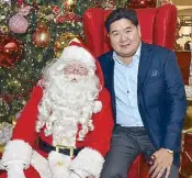 ??  ?? SSI Group president Anton Huang with Santa Claus, who gets his own corner from 5 p.m. to 7 p.m. every Saturday and Sunday of December until Christmas Day.