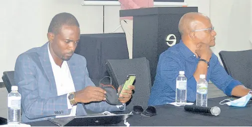  ??  ?? Peter Bunting (right), Opposition spokesman on education, sits at the head table with Dr Andre Haughton, the People’s National Party (PNP) candidate for West Central St James, during a meeting held under the theme ‘Shining a light on education’, which is a part of the PNP’s ‘Rising Sun’ series of meetings.