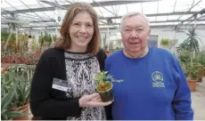  ??  ?? Andrea Burlingham and orchid show secretary Ray Huggins