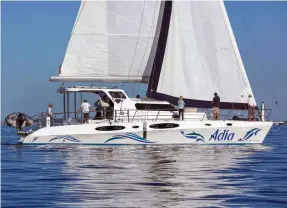  ??  ?? The Majestic 530’s bimini top does double duty as a platform on which slide-out solar panels are mounted.