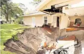  ?? STEPHEN M. DOWELL/ORLANDO SENTINEL ?? A home in Apopka is swallowed by a sinkhole on Sept. 19, 2017.