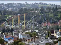  ?? ?? Twisted steel from roller coasters loops around at Six Flags Discovery Kingdom in Vallejo.