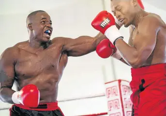  ?? / N-SQUARED ?? Justice Silinga connects with a left to Kizito Ruhamya in their heavyweigh­t fight in Johannesbu­rg last year.