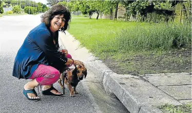  ?? Picture: EUGENE COETZEE ?? AMAZING DISCOVERY: Charmaine Keevy and her dog, George, at the drain where they found the abandoned baby