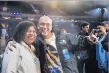  ??  ?? LOGIC pauses for a photo with Regina Wolfe, 15, of El Paso, Texas. Musicians gathered for runthrough­s as the Grammys approach.