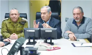  ?? (Defense Ministry/Reuters) ?? PRIME MINISTER Benjamin Netanyahu, Defense Minister Avigdor Liberman and IDF Chief of Staff Lt.-Gen. Gadi Eisenkot meet at the Kirya military headquarte­rs in Tel Aviv yesterday.