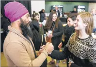  ?? MITCH MACDONALD/THE GUARDIAN ?? Federal NDP leader Jagmeet Singh chats with NDP P.E.I. member Kari Kruse during a meet and greet at the provincial party’s leadership convention in Murphy’s Community Centre on Saturday. Kruse said she was impressed by Singh, who advocated for a number...