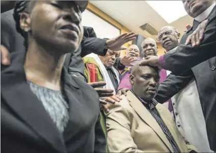  ?? Photo: Madelene Cronjé ?? The cult of Hlaudi: Religious leaders praying for then SABC chief executive Lulama Mokhobo and then acting chief operating officer Hlaudi Motsoeneng back in 2012.