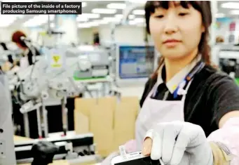  ??  ?? File picture of the inside of a factory producing Samsung smartphone­s.