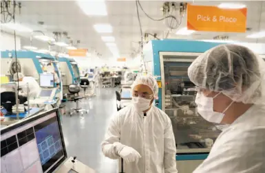  ?? Carlos Avila Gonzalez / The Chronicle ?? Technician­s monitor the retrieval of ingestible sensors at the Proteus Digital Health plant in Hayward.