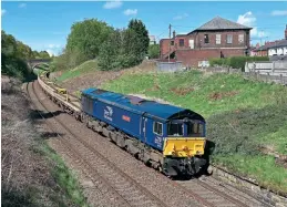  ?? Tom Mcatee. ?? Direct Rail Services 66301 Kingmoor TMD works 6K05, the 12.46 Carlisle to Crewe, passing through Brownhills, near Ramsgreave & Wilpshire on the Ribble Valley Line in Lancashire, on May 18, 2021. This locomotive is one of five Class 66/3s that will shortly be moving to GB Railfreigh­t to strengthen its fleet.