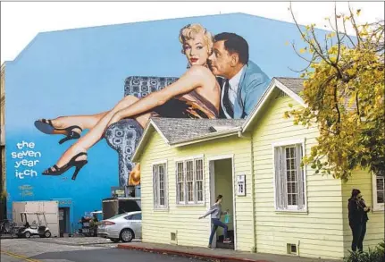  ?? Photograph­s by Mel Melcon Los Angeles Times ?? SCENIC painters Mike Denering and Jim Katranis refurbishe­d the “Seven Year Itch” mural that’s on Stage 10 at Fox Studios.