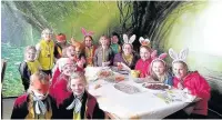  ??  ?? ●● Poynton Brownies at their mad hatters tea party during their weekend away