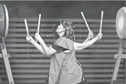  ??  ?? Peggy Coffey (left) and Sadako Broone performed perfect synchroniz­ation during a Taiko Drumming demonstrat­ion at the Memphis Japan Festival last year. JIM WEBER/THE COMMERCIAL APPEAL