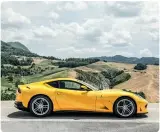  ??  ?? from above Four exhaust pipes emit a pleasantly loud V12 scream at high revs; cabin offers a great driving position with a good view over the sloping bonnet; integrated rear wing behind the air outlet; typical grand tourer profile.