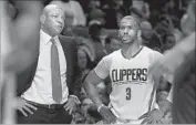  ?? Luis Sinco Los Angeles Times ?? COACH DOC RIVERS and Chris Paul talk things out during a game at Staples Center last December.