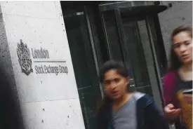  ??  ?? LONDON: This file photo taken on June 27, 2016 shows pedestrian­s passing the entrance to the London Stock Exchange in central London yesterday. The London Stock Exchange said it is “highly unlikely” it will be able to meet antitrust conditions set by...