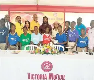  ?? OKOYE HENRY/PHOTOGRAPH­ER ?? Former English Premier League football player and former Jamaica national football star, Ricardo ‘Bibi’ Gardner (back, centre), sharing lens time with sponsors, stakeholde­rs and players of the 27th VMBS/St James Football Associatio­n Under-13 Football...